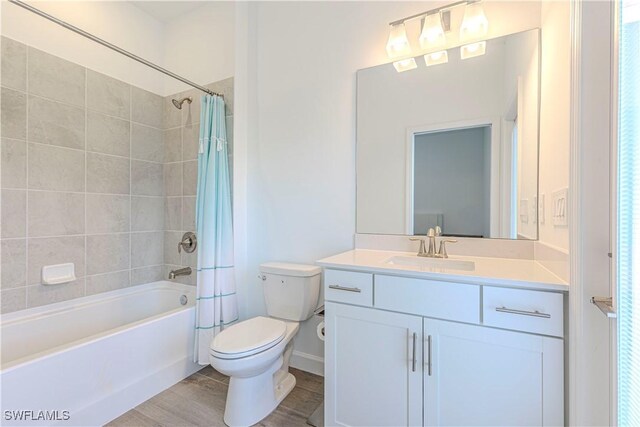 18707 Ivywood Pl, Estero, FL 33928 - full bathroom featuring toilet, shower / tub combo with curtain, vanity, and wood finished floors