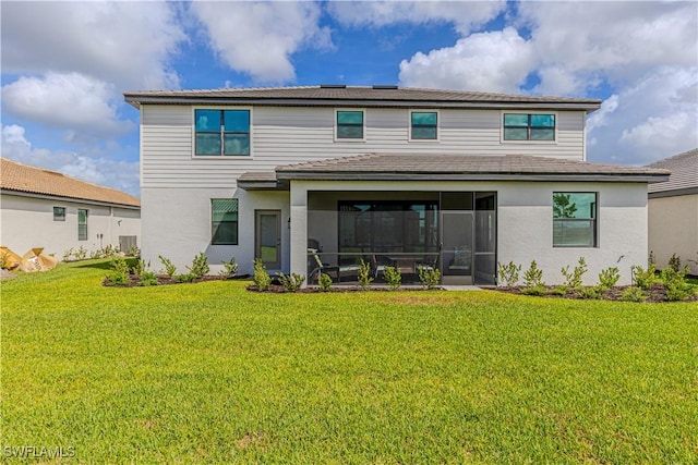 18707 Ivywood Pl, Estero, FL 33928 - back of house featuring a yard, a sunroom, and stucco siding