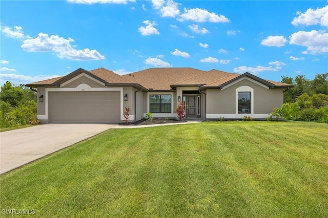 490 Windermere Dr, Lehigh Acres, FL 33972 - view of front of home featuring stucco siding, a garage, concrete driveway, and a front yard
