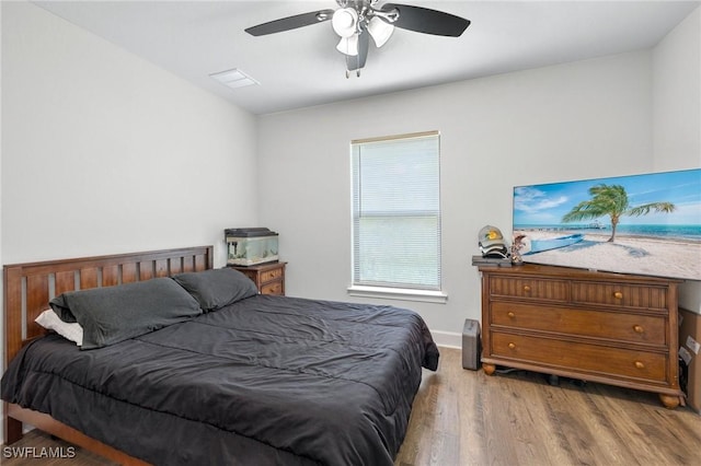 490 Windermere Dr, Lehigh Acres, FL 33972 - bedroom featuring baseboards, wood finished floors, and ceiling fan