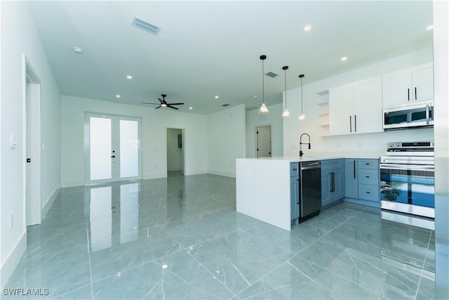 5308 4th St W, Lehigh Acres, FL 33971 - kitchen featuring appliances with stainless steel finishes, open shelves, french doors, a peninsula, and recessed lighting