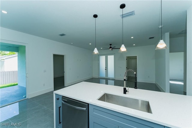 5308 4th St W, Lehigh Acres, FL 33971 - kitchen with a sink, stainless steel dishwasher, open floor plan, decorative light fixtures, and recessed lighting