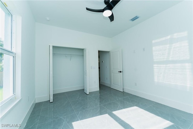 5308 4th St W, Lehigh Acres, FL 33971 - unfurnished bedroom with a closet, ceiling fan, and baseboards
