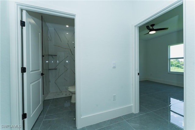 5308 4th St W, Lehigh Acres, FL 33971 - bathroom with toilet, a marble finish shower, tile patterned floors, and baseboards