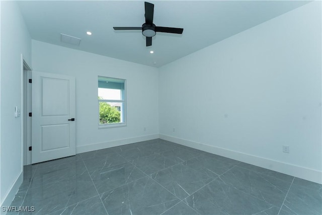 5308 4th St W, Lehigh Acres, FL 33971 - empty room with baseboards, ceiling fan, dark marble finish floors, and recessed lighting
