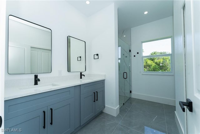 5308 4th St W, Lehigh Acres, FL 33971 - full bath with baseboards, double vanity, a shower stall, marble look tiles, and recessed lighting