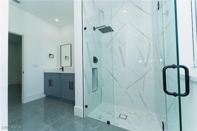5308 4th St W, Lehigh Acres, FL 33971 - bathroom with a marble finish shower, vanity, marble look tiles, and baseboards