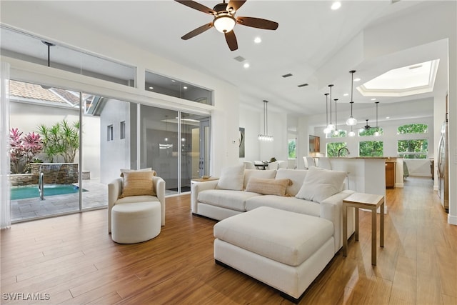 27549 Riverbank Dr, Bonita Springs, FL 34134 - living area with light wood-type flooring, ceiling fan, plenty of natural light, and recessed lighting