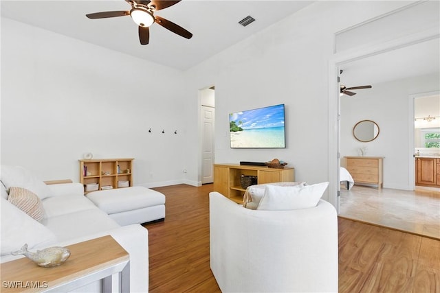 27549 Riverbank Dr, Bonita Springs, FL 34134 - living area featuring visible vents, baseboards, light wood-style flooring, and ceiling fan
