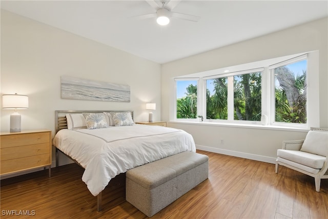27549 Riverbank Dr, Bonita Springs, FL 34134 - bedroom featuring baseboards, a ceiling fan, and wood finished floors