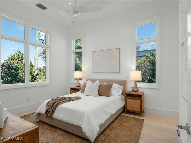 619 Binnacle Dr, Naples, FL 34103 - bedroom featuring baseboards, visible vents, and wood finished floors