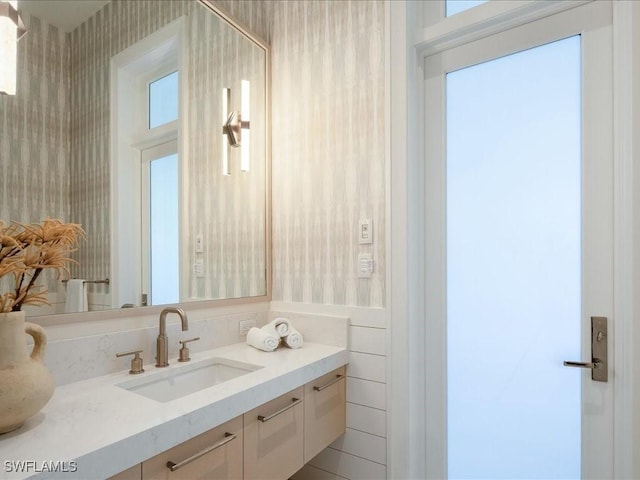 619 Binnacle Dr, Naples, FL 34103 - bathroom featuring wallpapered walls and vanity