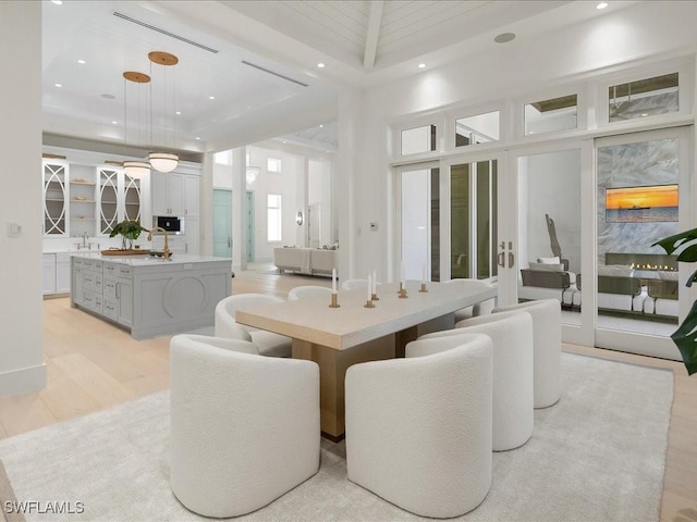 619 Binnacle Dr, Naples, FL 34103 - dining area with light wood-type flooring and recessed lighting