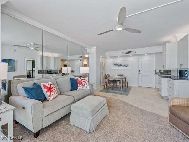 140 Seaview Ct Unit 1703N, Marco Island, FL 34145 - living room with a ceiling fan, ornamental molding, light tile patterned flooring, and light colored carpet
