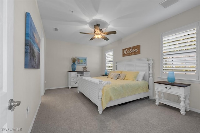 bedroom with baseboards, visible vents, ceiling fan, and carpet flooring