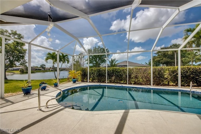 pool featuring a lanai, a patio, and a water view