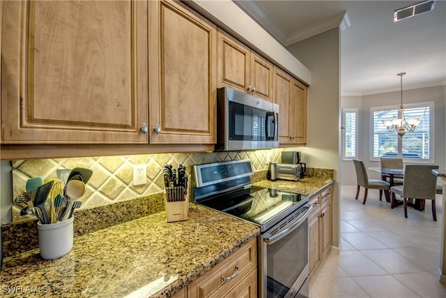 kitchen with appliances with stainless steel finishes, tasteful backsplash, a chandelier, and visible vents
