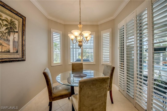 dining area featuring baseboards, crown molding, a chandelier, and light tile patterned floors