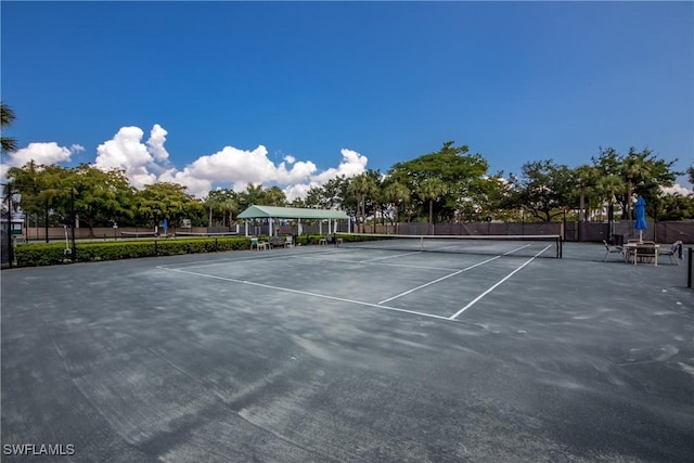 view of sport court featuring fence
