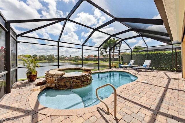 view of pool with a pool with connected hot tub, a lanai, a water view, and a patio area