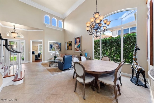 dining room featuring light tile patterned floors, ornamental molding, baseboards, a towering ceiling, and a notable chandelier