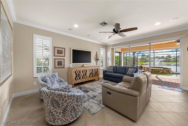 living area with baseboards, visible vents, ceiling fan, and ornamental molding