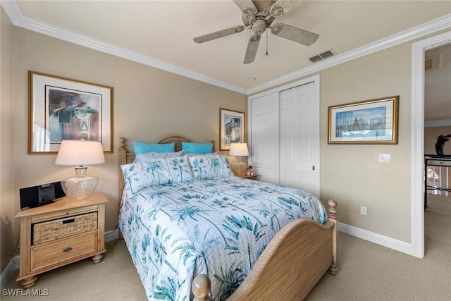 bedroom featuring crown molding, a closet, and light colored carpet