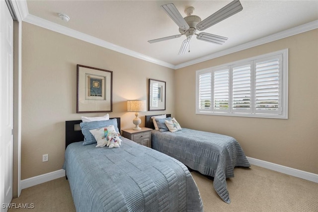 bedroom with baseboards, carpet flooring, and crown molding