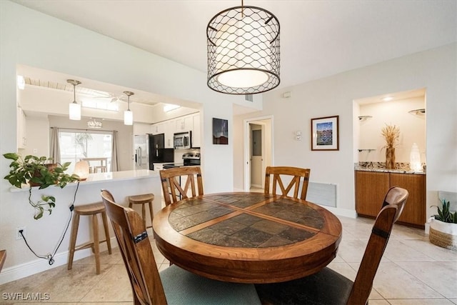 6025 Chardonnay Ln Unit 103, Naples, FL 34119 - dining area featuring light tile patterned flooring and baseboards