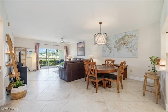 6025 Chardonnay Ln Unit 103, Naples, FL 34119 - dining room featuring light tile patterned floors, baseboards, and ceiling fan