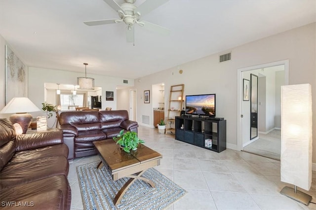 6025 Chardonnay Ln Unit 103, Naples, FL 34119 - living area featuring ceiling fan, baseboards, light tile patterned flooring, and visible vents