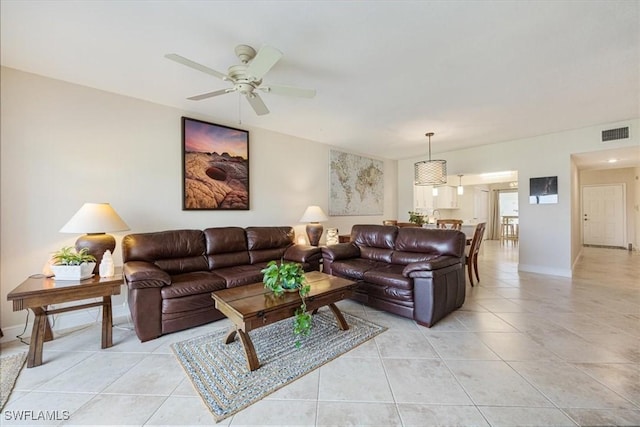 6025 Chardonnay Ln Unit 103, Naples, FL 34119 - living area with ceiling fan, baseboards, visible vents, and light tile patterned floors