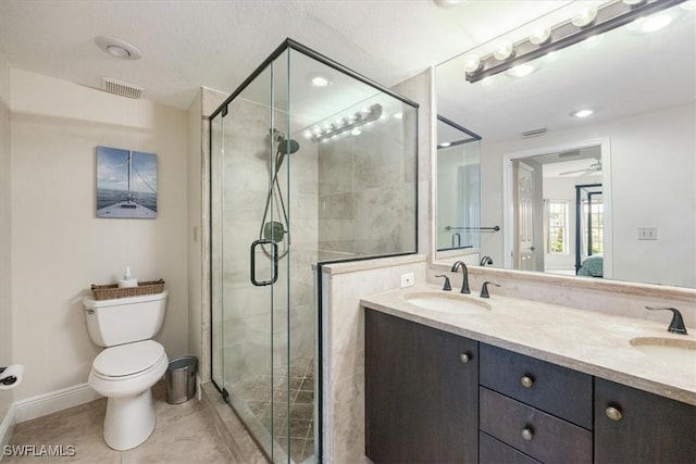 6025 Chardonnay Ln Unit 103, Naples, FL 34119 - bathroom with a shower stall, tile patterned flooring, visible vents, toilet, and a sink