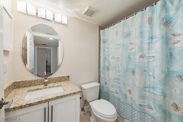 6025 Chardonnay Ln Unit 103, Naples, FL 34119 - bathroom with curtained shower, visible vents, toilet, and vanity