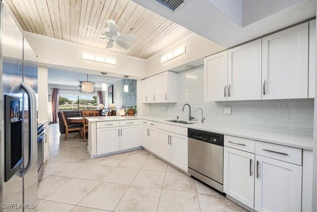 6025 Chardonnay Ln Unit 103, Naples, FL 34119 - kitchen with ceiling fan, wooden ceiling, stainless steel appliances, and a sink