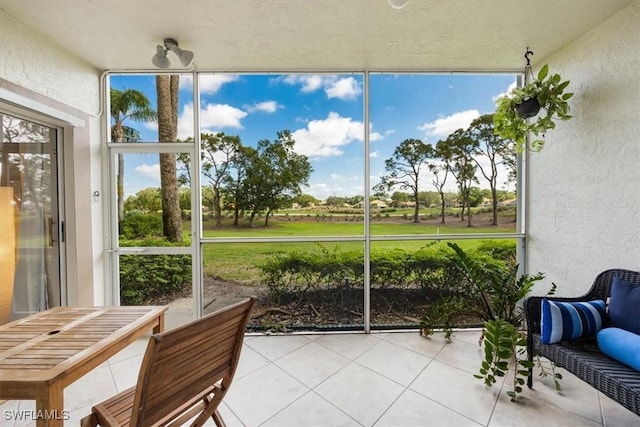 6025 Chardonnay Ln Unit 103, Naples, FL 34119 - sunroom / solarium featuring a healthy amount of sunlight