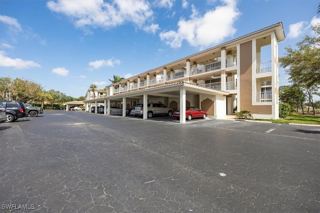6025 Chardonnay Ln Unit 103, Naples, FL 34119 - view of partially covered parking lot