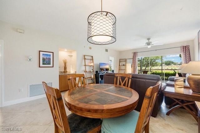 6025 Chardonnay Ln Unit 103, Naples, FL 34119 - dining area featuring ceiling fan, baseboards, visible vents, and light tile patterned floors