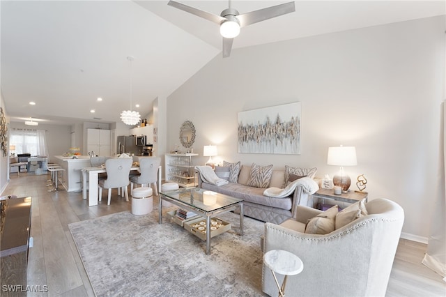 5045 Cedar Springs Dr Unit 203, Naples, FL 34110 - living area featuring recessed lighting, lofted ceiling, wood finished floors, a ceiling fan, and baseboards