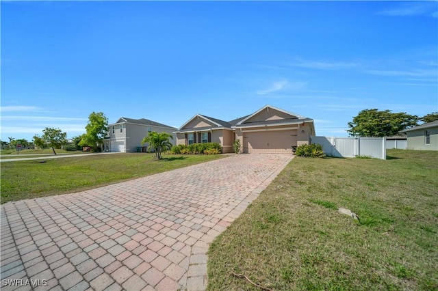 ranch-style house featuring a front yard, fence, a garage, and decorative driveway