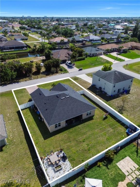 birds eye view of property with a residential view