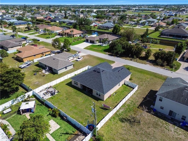 birds eye view of property with a residential view