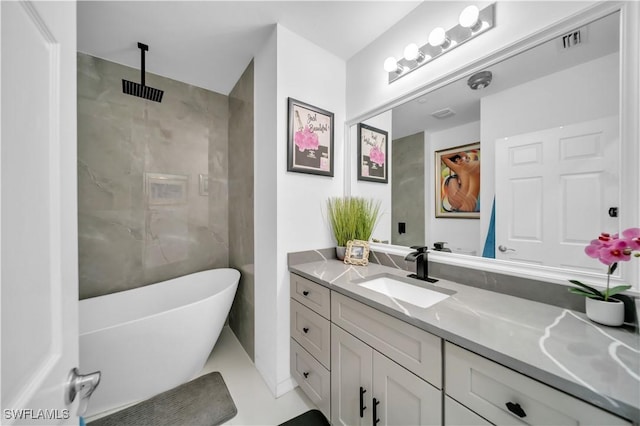 bathroom featuring visible vents, walk in shower, a freestanding tub, and vanity