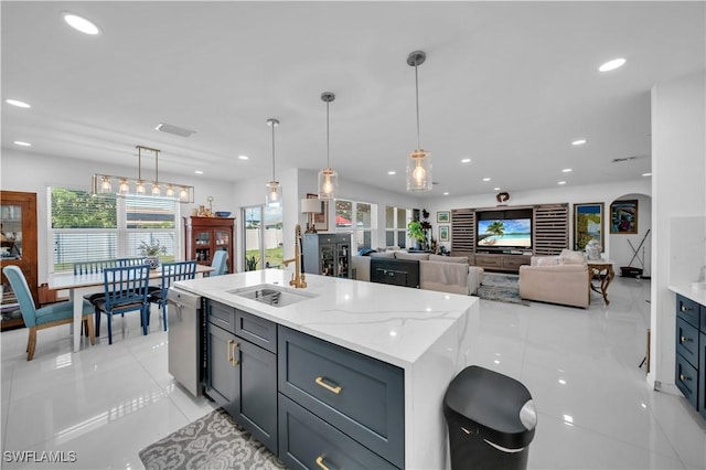kitchen featuring dishwasher, a sink, light tile patterned floors, and recessed lighting