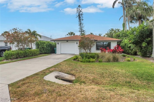 590 104th Ave N, Naples, FL 34108 - ranch-style home with driveway, a front lawn, and an attached garage