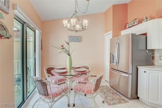 dining space with a chandelier and light tile patterned floors