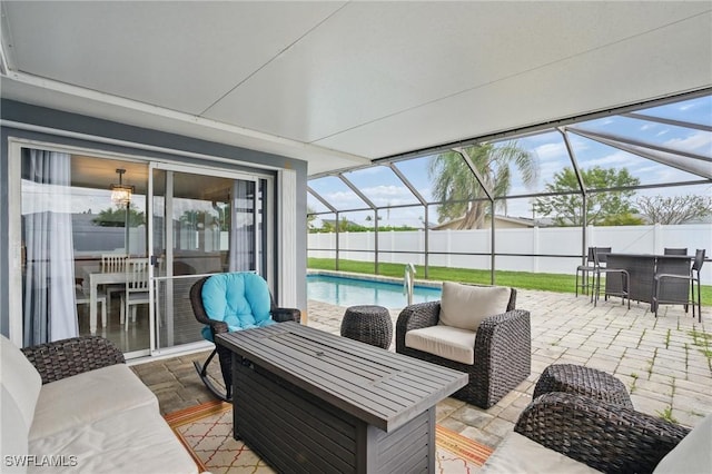 2941 SE 10th Pl, Cape Coral, FL 33904 - view of patio with a lanai, an outdoor living space, a fenced in pool, and fence