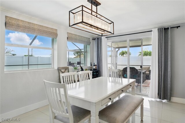 2941 SE 10th Pl, Cape Coral, FL 33904 - dining area with crown molding, tile patterned floors, and a wealth of natural light