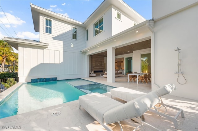 1179 Broad Ave N, Naples, FL 34102 - view of swimming pool with a patio, a pool with connected hot tub, outdoor lounge area, and outdoor dining space