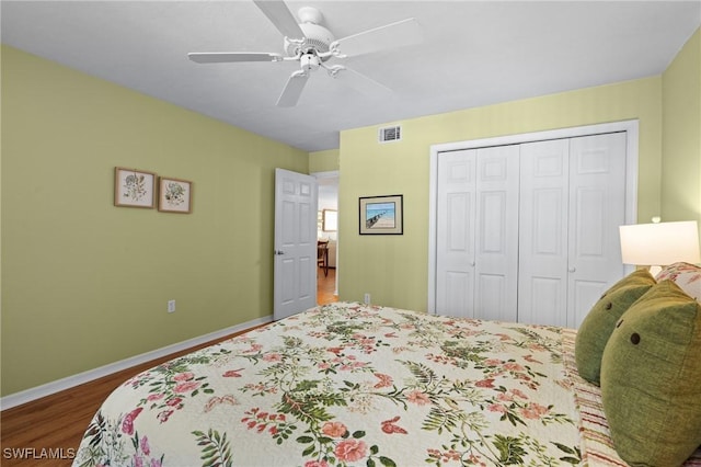 270 Naples Cove Dr Unit 3205, Naples, FL 34110 - bedroom featuring a closet, wood finished floors, visible vents, ceiling fan, and baseboards